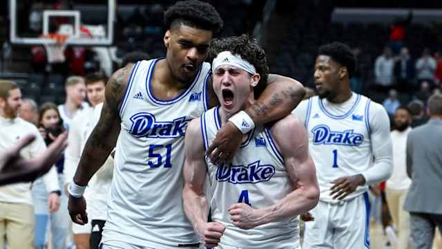 Drake Bulldogs guard Conor Enright (4) and forward Darnell Brodie (51) celebrate after the Bulldogs defeated the Bradley Braves in the Missouri Valley Conference Tournament semifinal game at Enterprise Center in St. Louis on March 9, 2024.